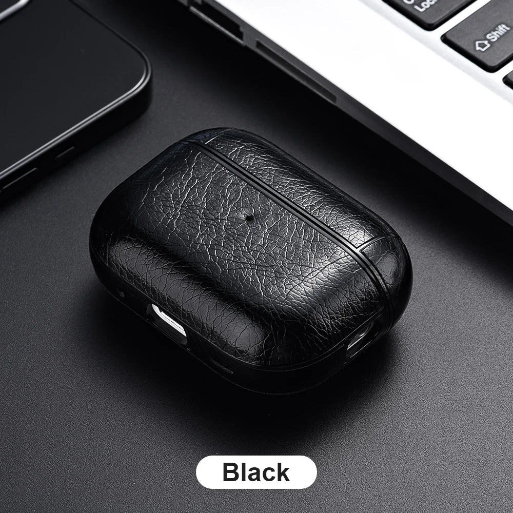 Black leather case on a dark surface with a phone and laptop in the background