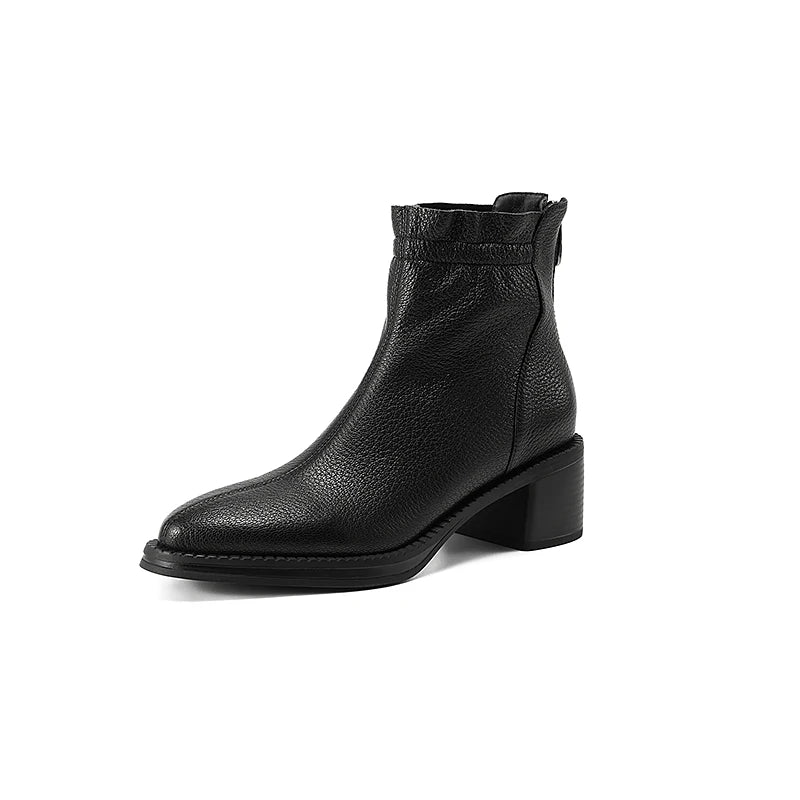 Black leather ankle boot on a white background