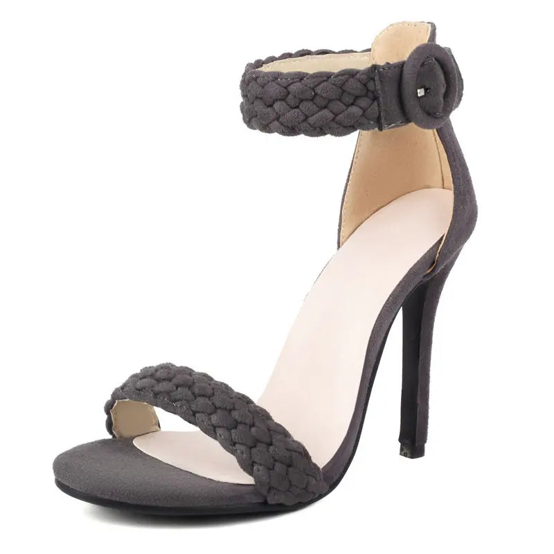 Gray high-heeled sandal with braided design on a white background