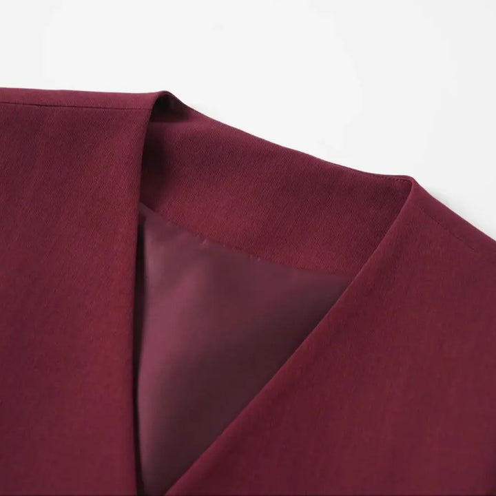 Close-up of a maroon fabric texture on a white background