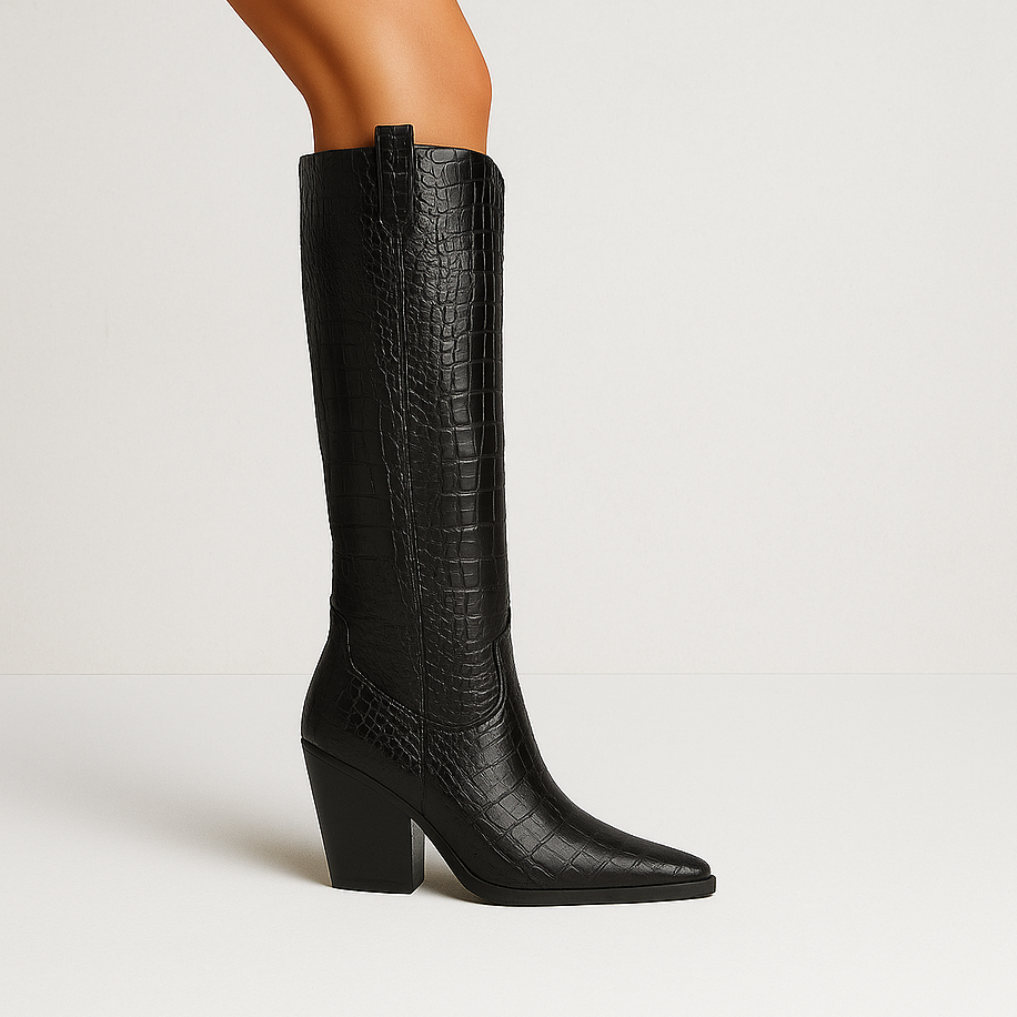 Black knee-high boot with a block heel on a light gray background