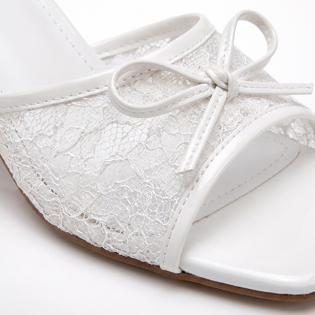 White Phoebe lace kitten heels, lace and bow close-up