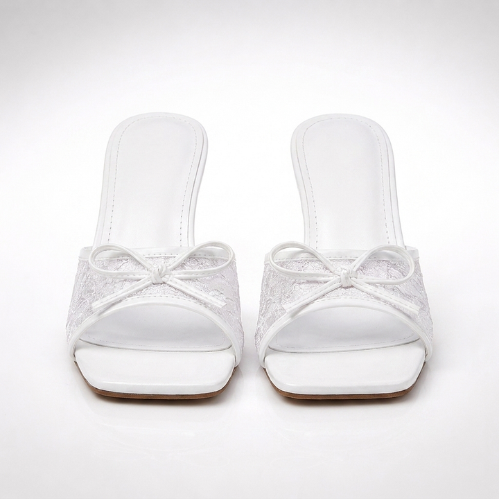 White Phoebe lace kitten heels, front view of the pair